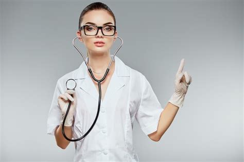 Premium Photo Pretty Doctor With Brown Hair And Nude Make Up Wearing White Medical Uniform