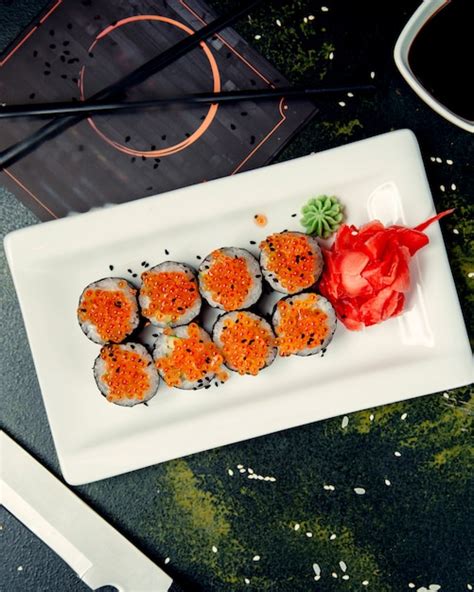 Free Photo | Sushi rolls topped with caviar