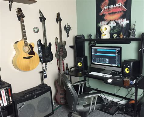 Compact Home Recording Studio Setup with Guitars and iMac