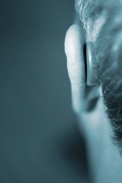 Premium Photo Close Up Of Man Wearing Hearing Aid