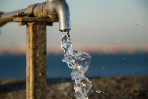 Premium Photo Close Up Of Water Flowing From Tap