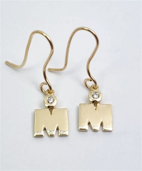 Commemorative Ironman Gold Diamond Earrings Rocks And Diamonds Taupo