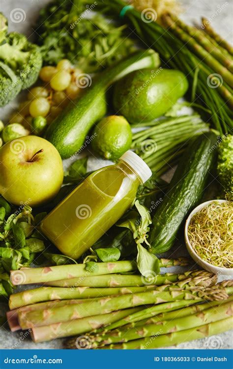 Green Antioxidant Organic Vegetables Fruits And Herbs Placed On Gray