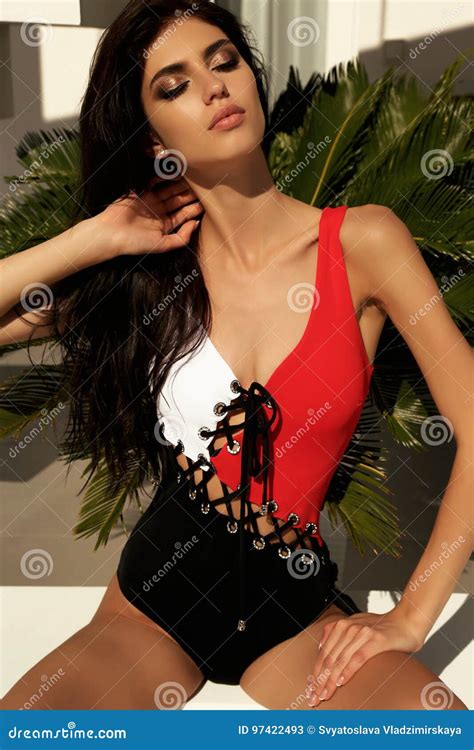 Girl With Dark Hair In Swimsuit Relaxing Near Swimming Pool Stock Image Image Of Brunette