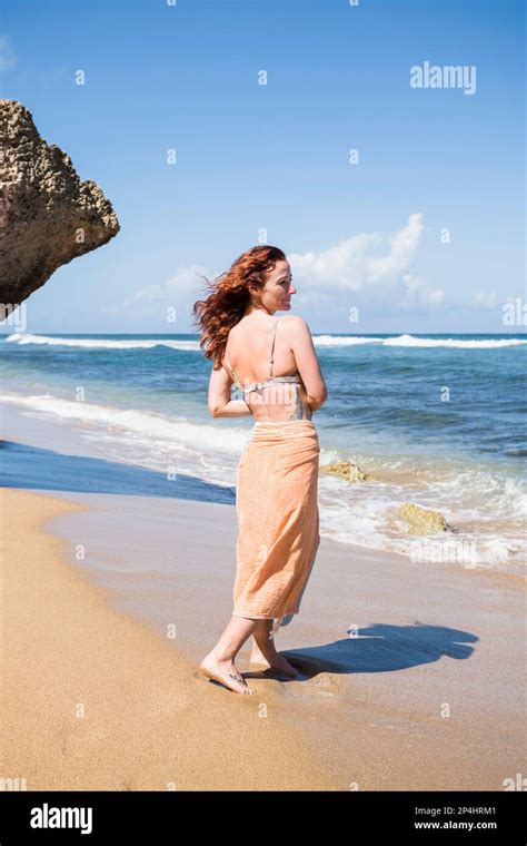 Solo Woman In A Bikini With Towel At The Beach In Puerto Rico Stock Photo Alamy