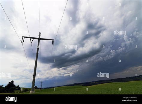 A Storm At The Himmer Over An Electricity Pylon Dark Rain Clouds In