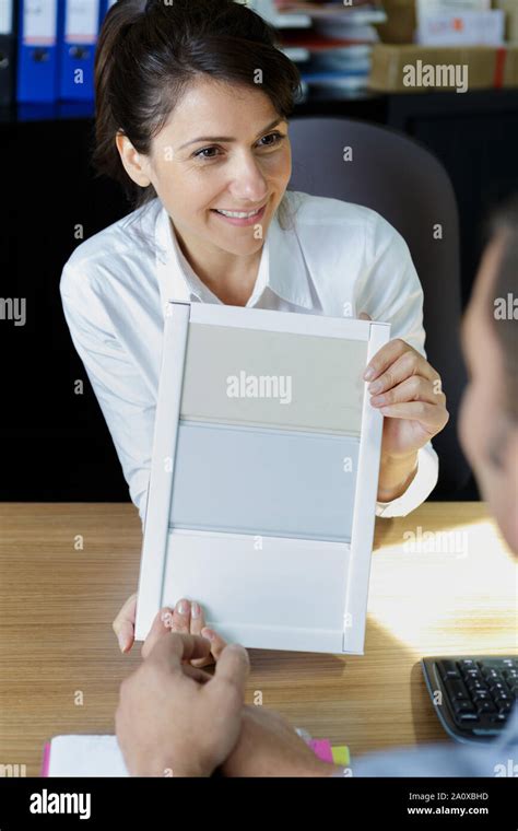 designer showing color swatches to client Stock Photo - Alamy