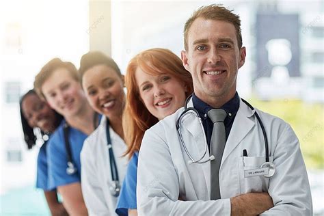 Medical Team Unites For Your Health At Hospital Photo Background And ...