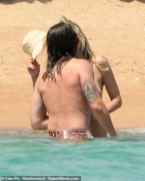Heidi Klum Flaunts Her Fit Figure In A Pink Bikini While Enjoying A Swim With Husband Tom