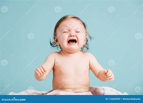 Sad Baby Sitting Down And Crying Stock Photo Image Of Studio