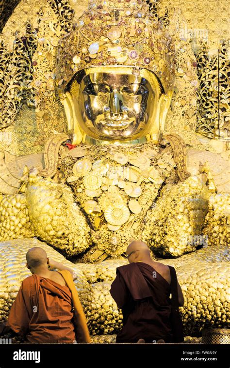 Mahamuni Paya Devotees Praying And Pressing Gold Leaf Onto The