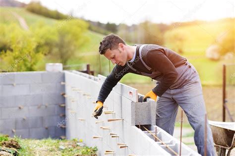 Man Building A House — Stock Photo © Halfpoint 72071737