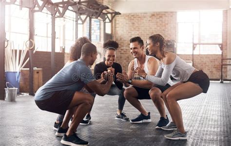 Friends Exercise And Squat In Group At Gym For Workout Core Fitness