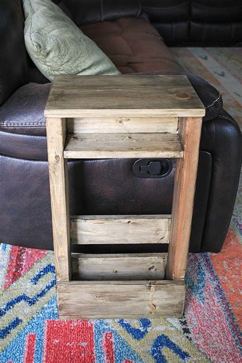 a small wooden table sitting on top of a rug next to a couch and chair