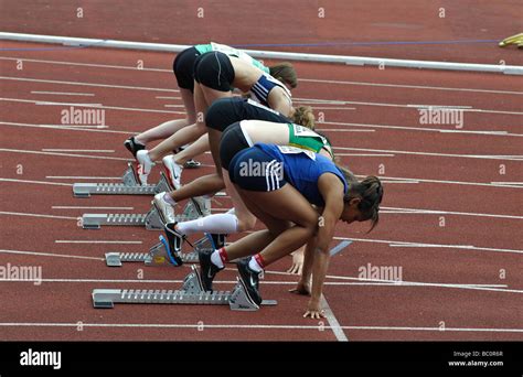 Runners In Starting Blocks Stock Photo Alamy