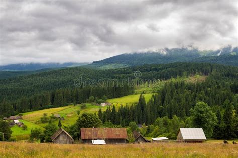 Rural Houses In Carpathian Mountains Cloudy Summer Landscape Ukraine