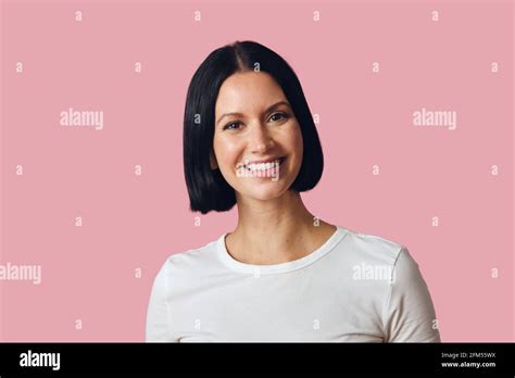 Studio Portrait Of Brunette Smiling Looking At Camera Stock Photo Alamy