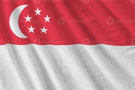 Singapore Flag With Big Folds Waving Close Up Under The Studio Light