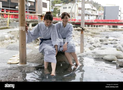 Two Women Soaking Their Feet In Hot Spring Stock Photo Alamy