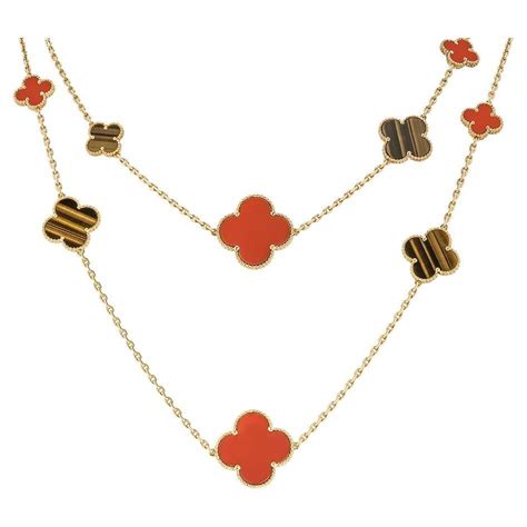 Van Cleef And Arpels Yellow Gold Carnelian And Tiger S Eye Magic