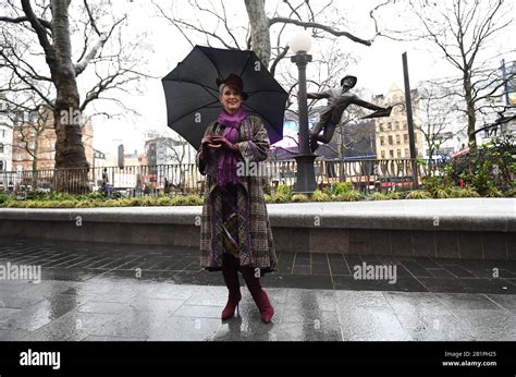 Patricia Ward Widow Of Gene Kelly Alongside A Statue Of The Hollywood