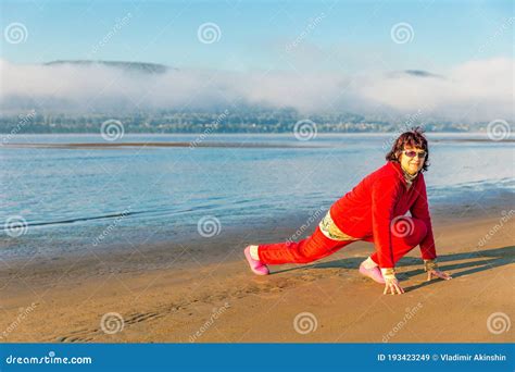 A Beautiful Mature Woman Walks Along A Sandy Beach Stock Image Image Of Forest Balance