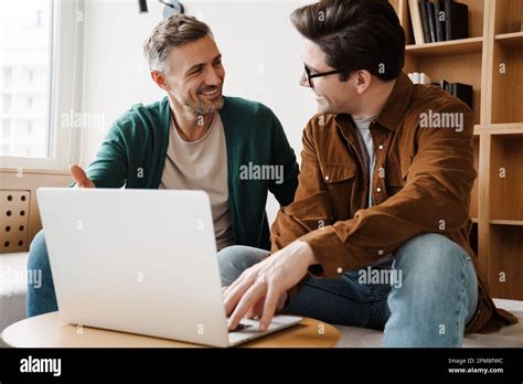 Happy Gay Couple Using Laptop Hi Res Stock Photography And Images Alamy
