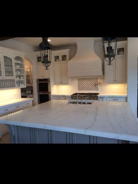 Calcutta quartzite | Kitchen renovation, House styles, Kitchen design