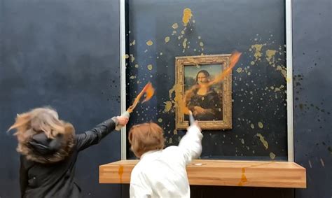 Mona Lisa painting targetted by protesters who throw pumpkin soup at da ...