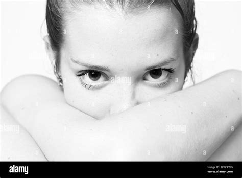 Black And White Photograph Of Woman Staring Intently Into The Camera