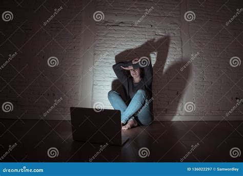 Woman Suffering Internet Cyber Bullying And Harassment Feeling Lonely Looking Afraid At Laptop