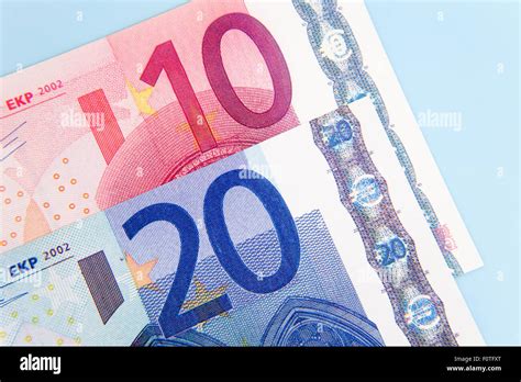 30 euro on light blue background Stock Photo - Alamy