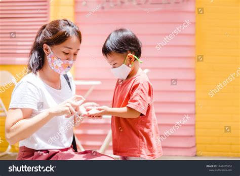 Asian Mother Clean Her Kid Hands Stock Photo 1743475952 Shutterstock