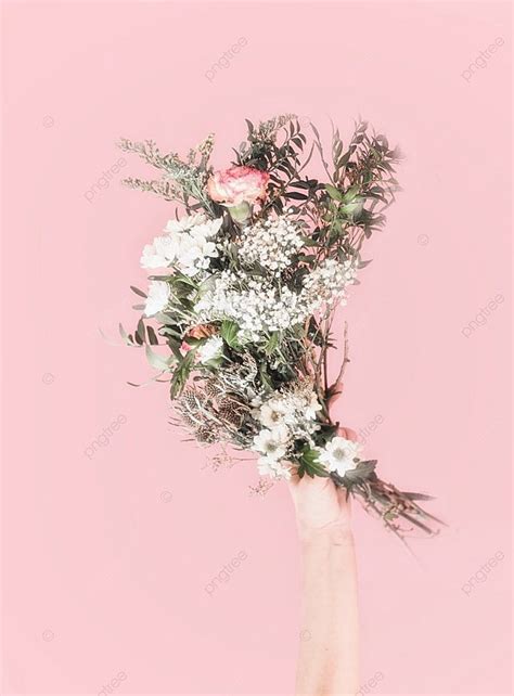 Women Hand Holding Bouquet Of Fresh Flowers At Light Pink Background