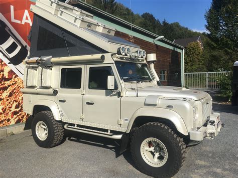 Land Rover Defender parked in front of a building