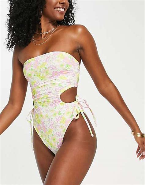 Asos Design Ruched Side Cut Out Bandeau Swimsuit In Ditsy Floral Print