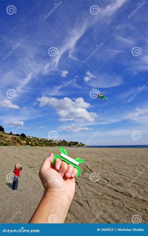 Flying a Kite on the Beach stock image. Image of beach - 366953