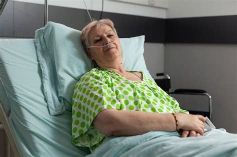 Free Photo Portrait Of Sick Pensioner Woman Looking Into Camera While