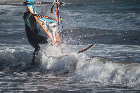 Hrough The Waves Girl Windsurfing At The Atlantic Ocean El Medano