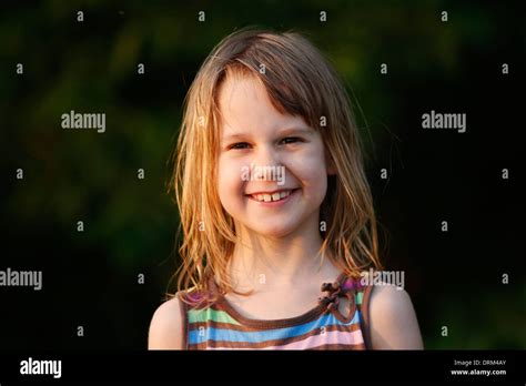 Portrait of smiling little girl at sunshine Stock Photo - Alamy