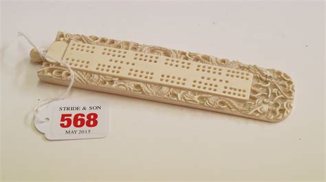 A Chinese Carved Ivory Cribbage Board Circa 1900 Carved With Dragons