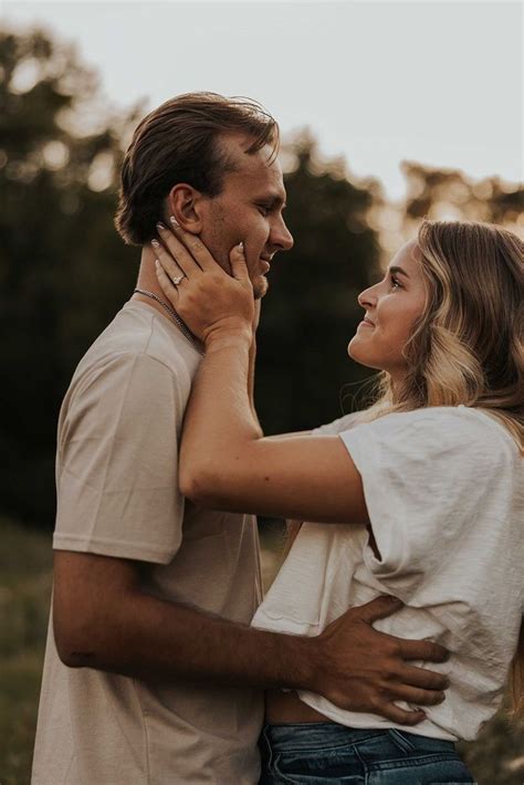 Playful Engagement Photos In A Field Couples Photoshoot Outfits