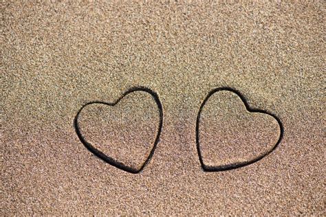 Two Sand Heart Shape In The Sand By The Sea Stock Image Image Of