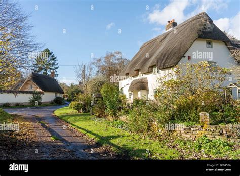 Pretty Thatched Cottages In The Village Of Tarrant Monkton Dorset