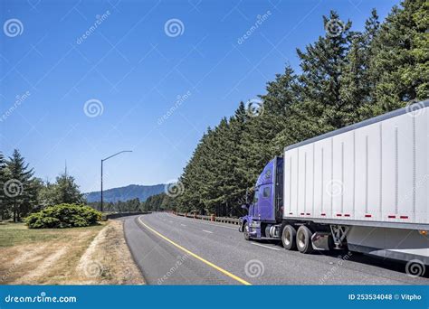 Purple Bonnet Big Rig Semi Truck With Dry Van Semi Trailer Running On