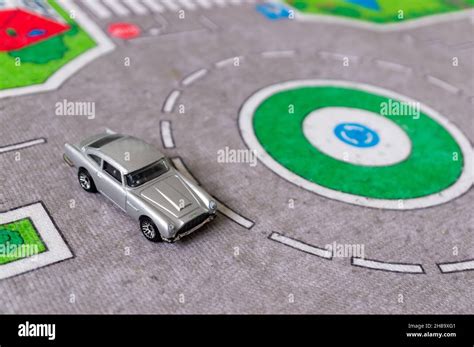 POZNAN POLAND Sep A Mattel Hot Wheels Aston Martin Toy Car On A Road Mat Stock