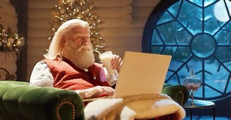 See John Travolta's Grey Beard as Santa Claus in a Commercial with ...