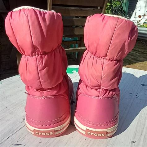 Size 8 kids crocs, pink snow boots. Excellent... - Depop