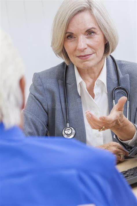 Senior Female Hospital Patient In Walking Frame Doctor Nurse Stock