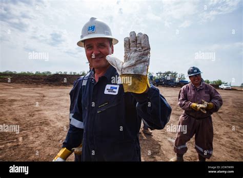 Zhaik Munai Oil Deposit Kazakhstan Smiling And Posing Happy Oil